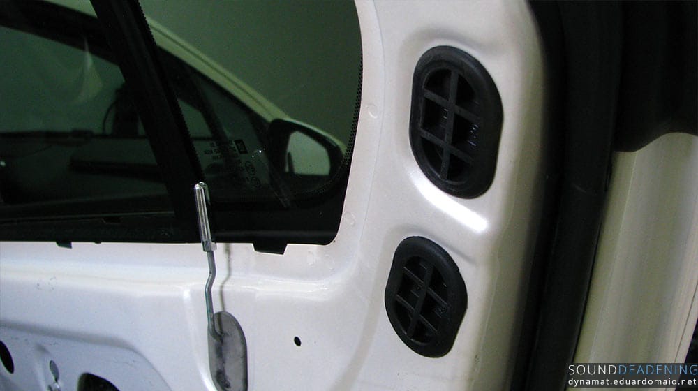 Rubber grommets to allow access to the bolts that hold the plastic black trim on the door upper side