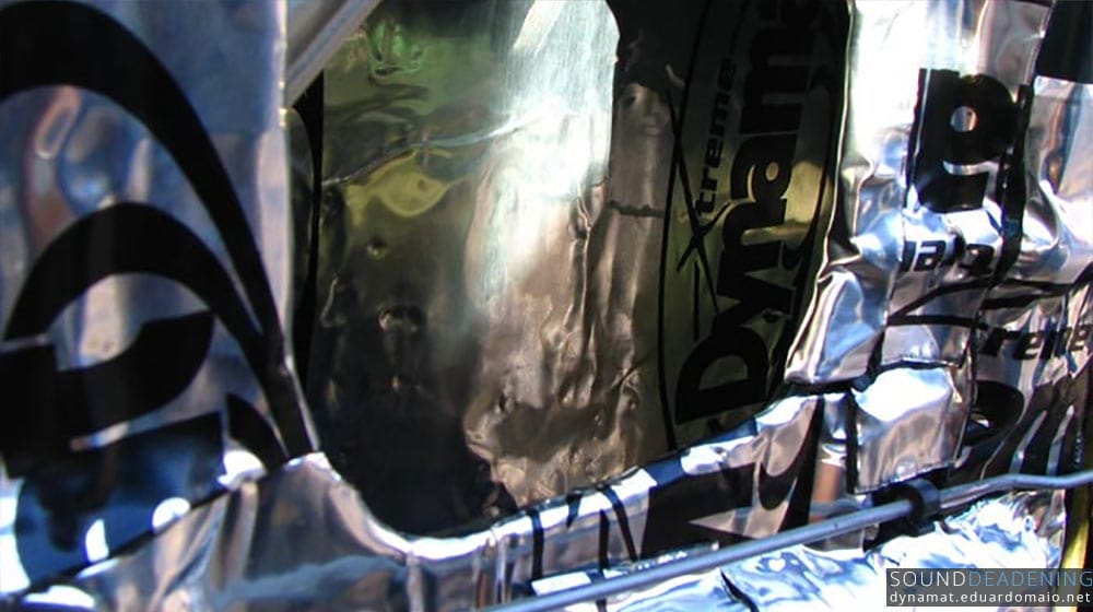 Dynamat Extreme in the inner and outer door skin. Notice the folded Dynamat on the inner door skin near the access hole